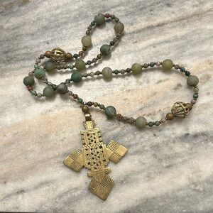 Intricate beaded cross necklace
